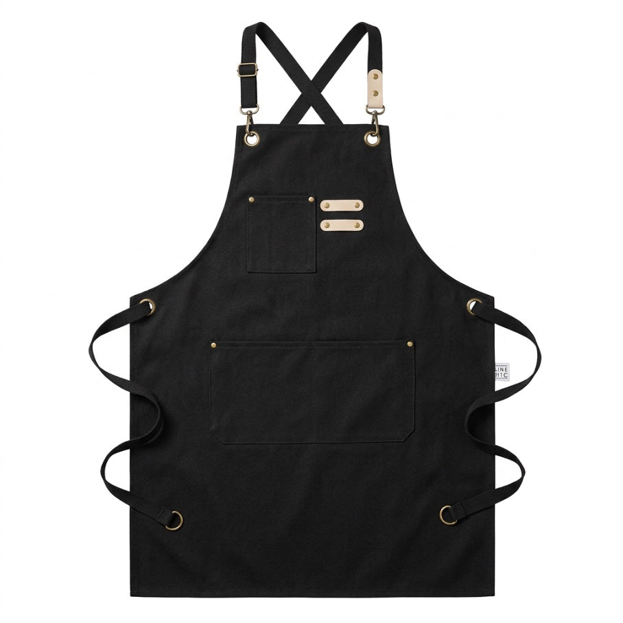 The Wine Chic Cross-Back Apron — black waxed canvas apron, flat lay