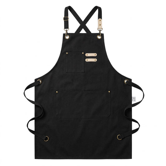 The Wine Chic Cross-Back Apron — black waxed canvas apron, flat lay